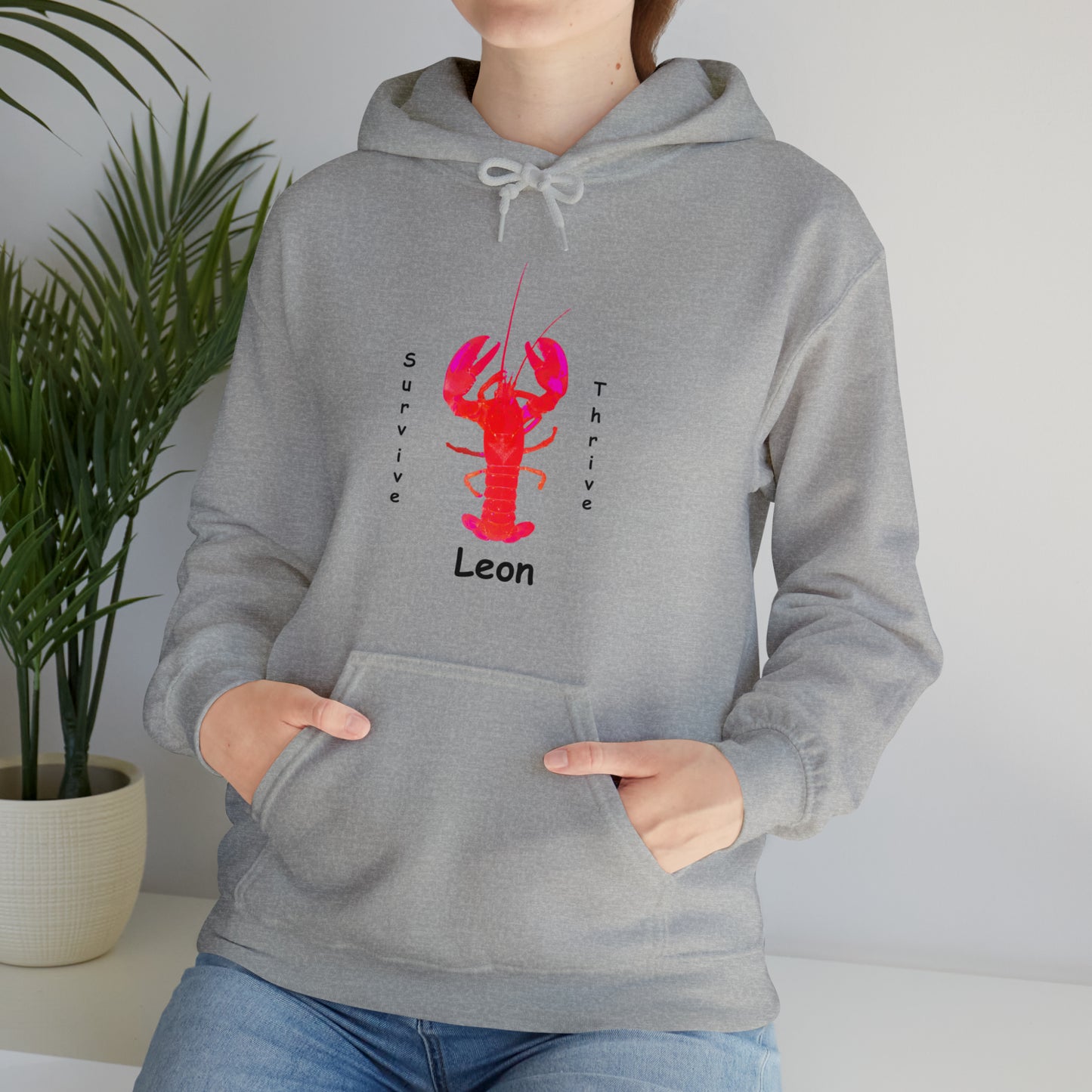 Unisex Heavy Blend™ Hooded Sweatshirt.  The art is from an actual photo of Leon, complete with his trademark back patch,... survive, thrive,...