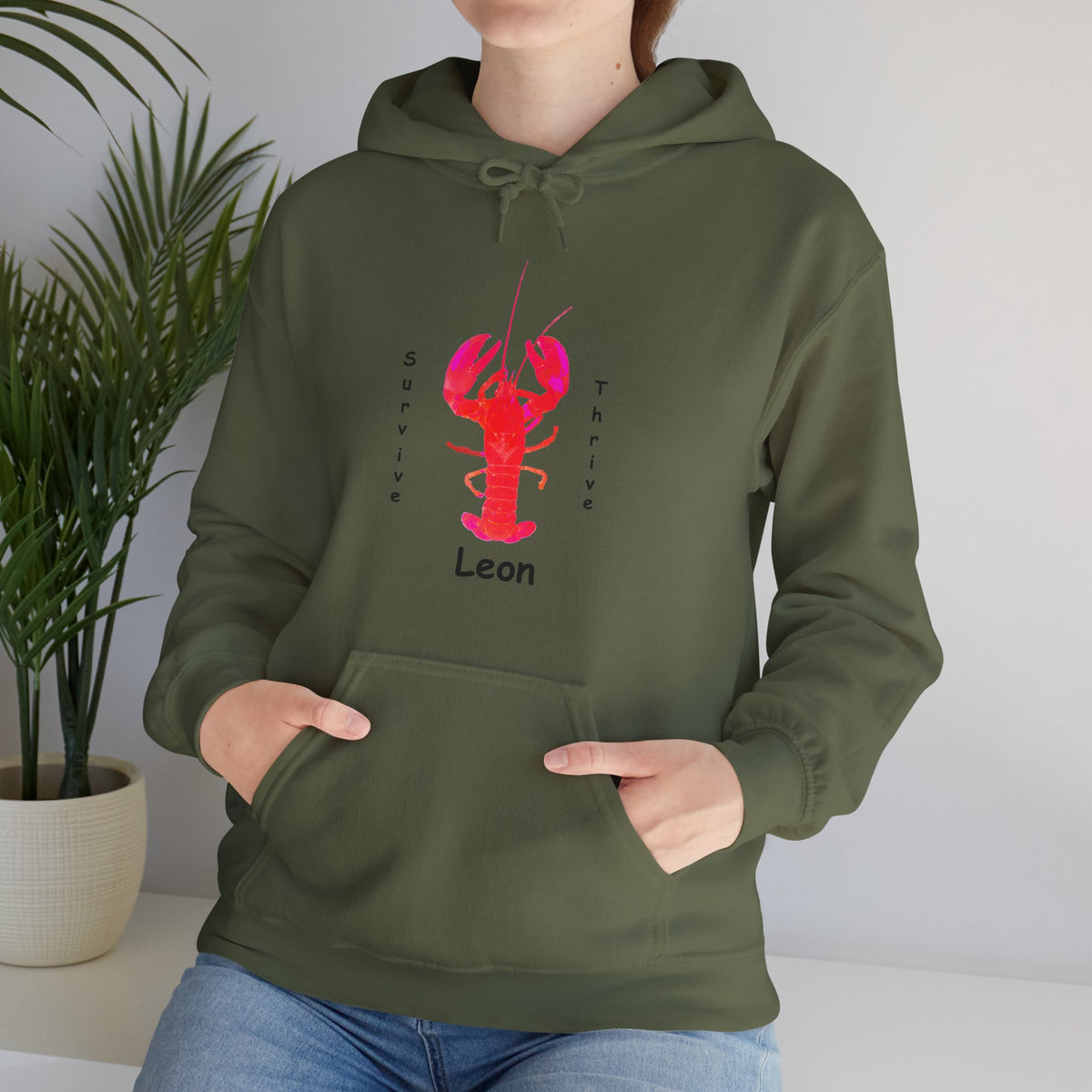 Unisex Heavy Blend™ Hooded Sweatshirt.  The art is from an actual photo of Leon, complete with his trademark back patch,... survive, thrive,...
