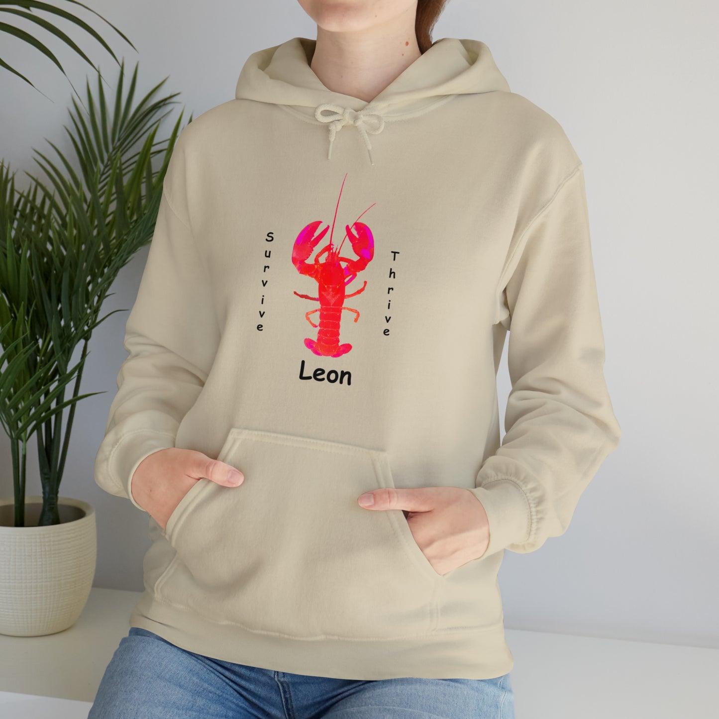 Unisex Heavy Blend™ Hooded Sweatshirt.  The art is from an actual photo of Leon, complete with his trademark back patch,... survive, thrive,...