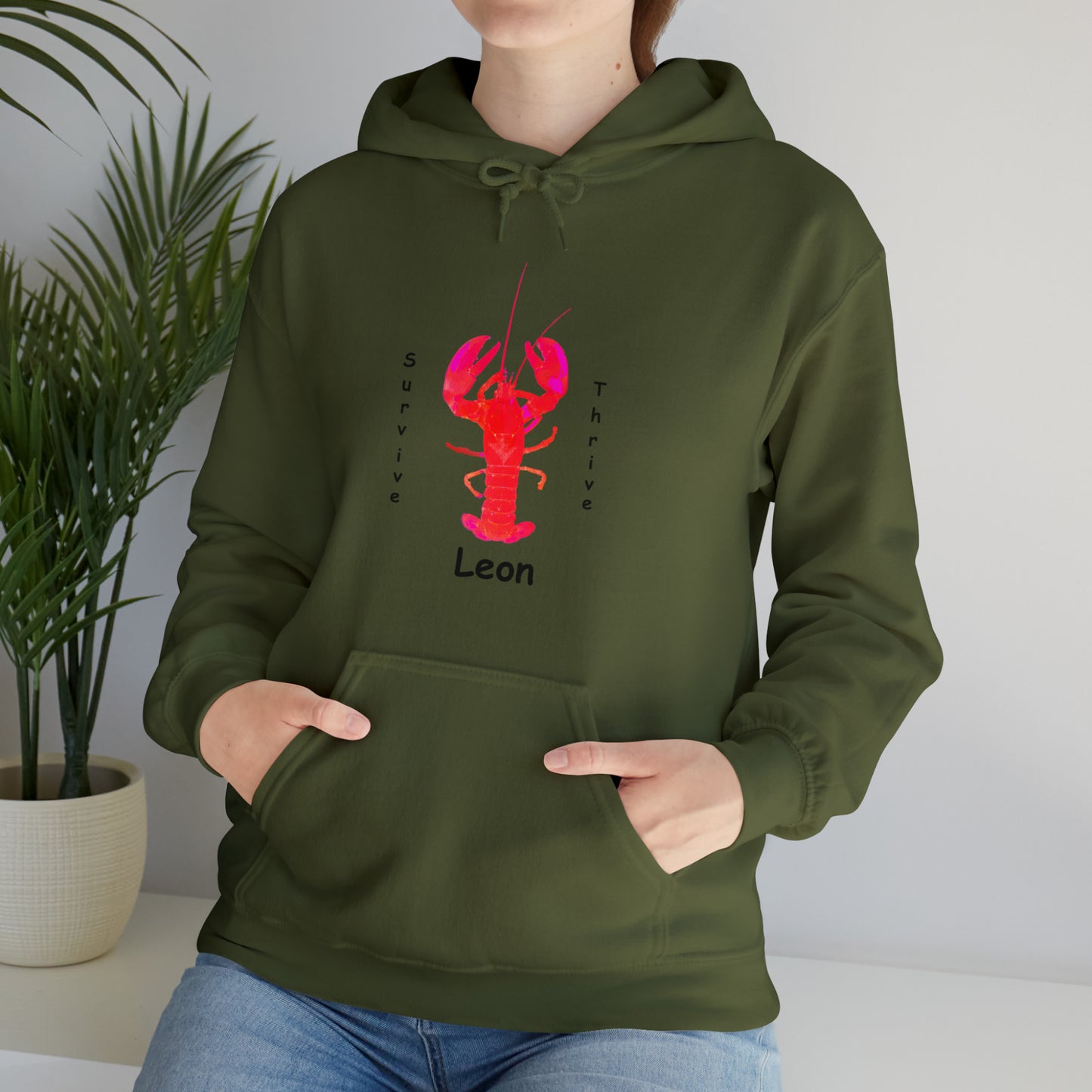 Unisex Heavy Blend™ Hooded Sweatshirt.  The art is from an actual photo of Leon, complete with his trademark back patch,... survive, thrive,...